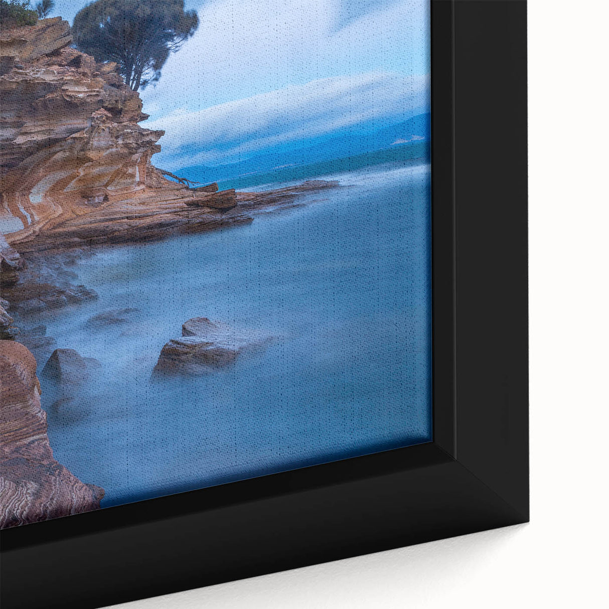 Extra large framed canvas of a textured Tasmanian landscape in black with colorful accents, ideal for living room decor.