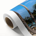 Art Deco style poster of Antigua scenery on rolled canvas, featuring vibrant blue and green tones.