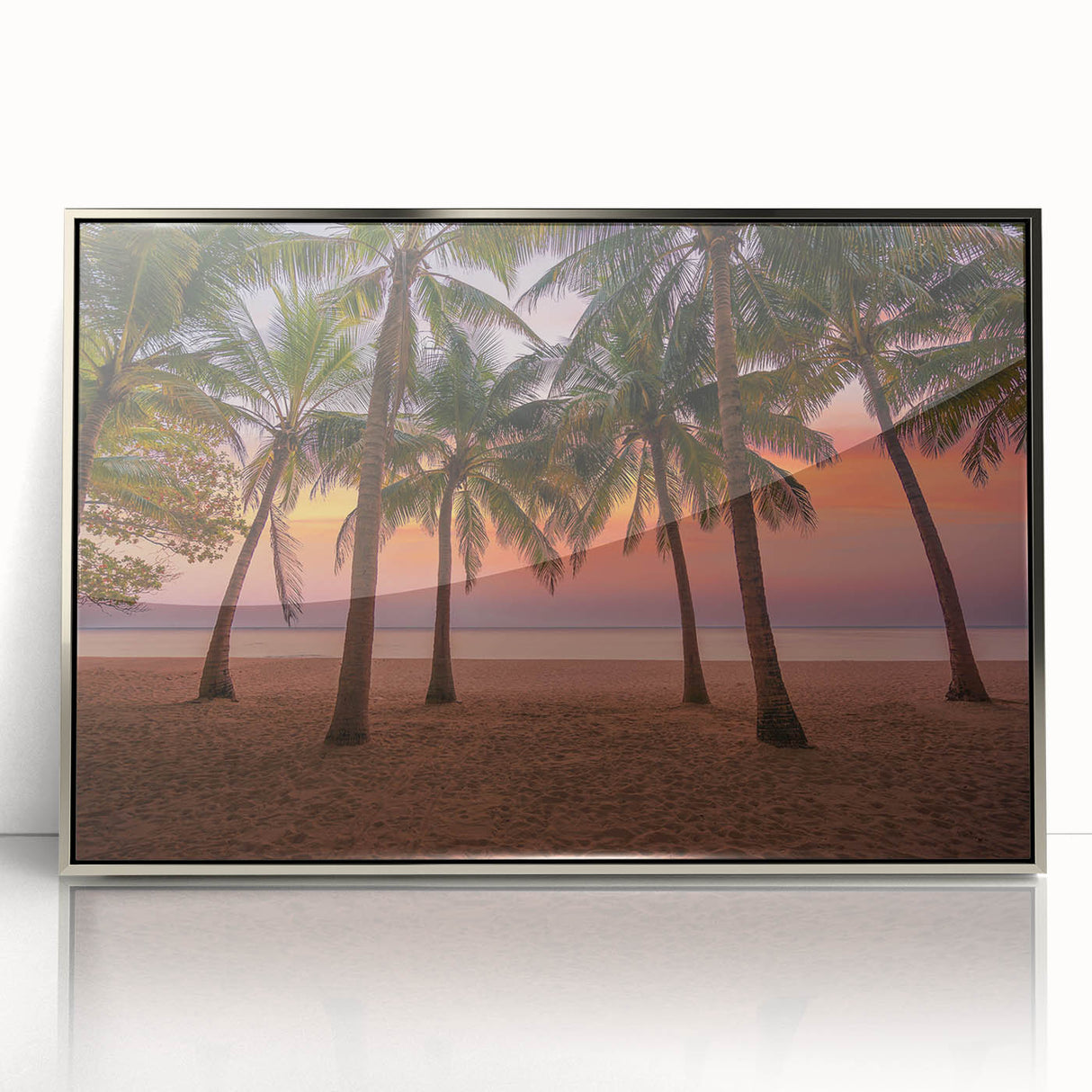 Art deco poster depicting a Caribbean scenery in silver-framed acrylic, with vibrant blue and green tones.