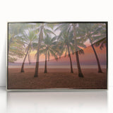 Art deco poster depicting a Caribbean scenery in silver-framed acrylic, with vibrant blue and green tones.