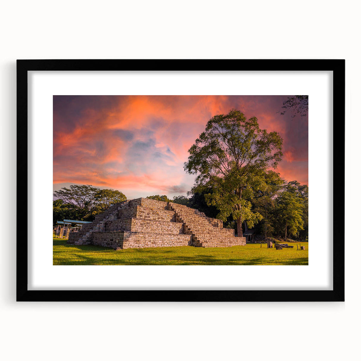 Abstract art print depicting a colorful, textured Central American landscape on a large framed canvas.