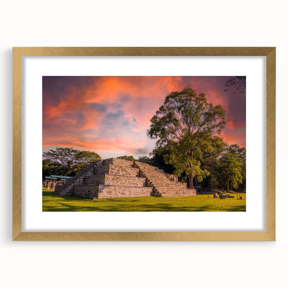 Extra large abstract art print depicting vibrant, textured scenery of Central America, in a gold frame.