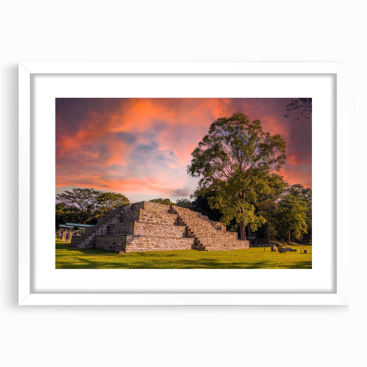 Abstract art print of a Central American landscape in muted earth tones on a white framed canvas.