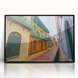 Large abstract wall art depicting a vibrant Central American scenery in a black framed acrylic.