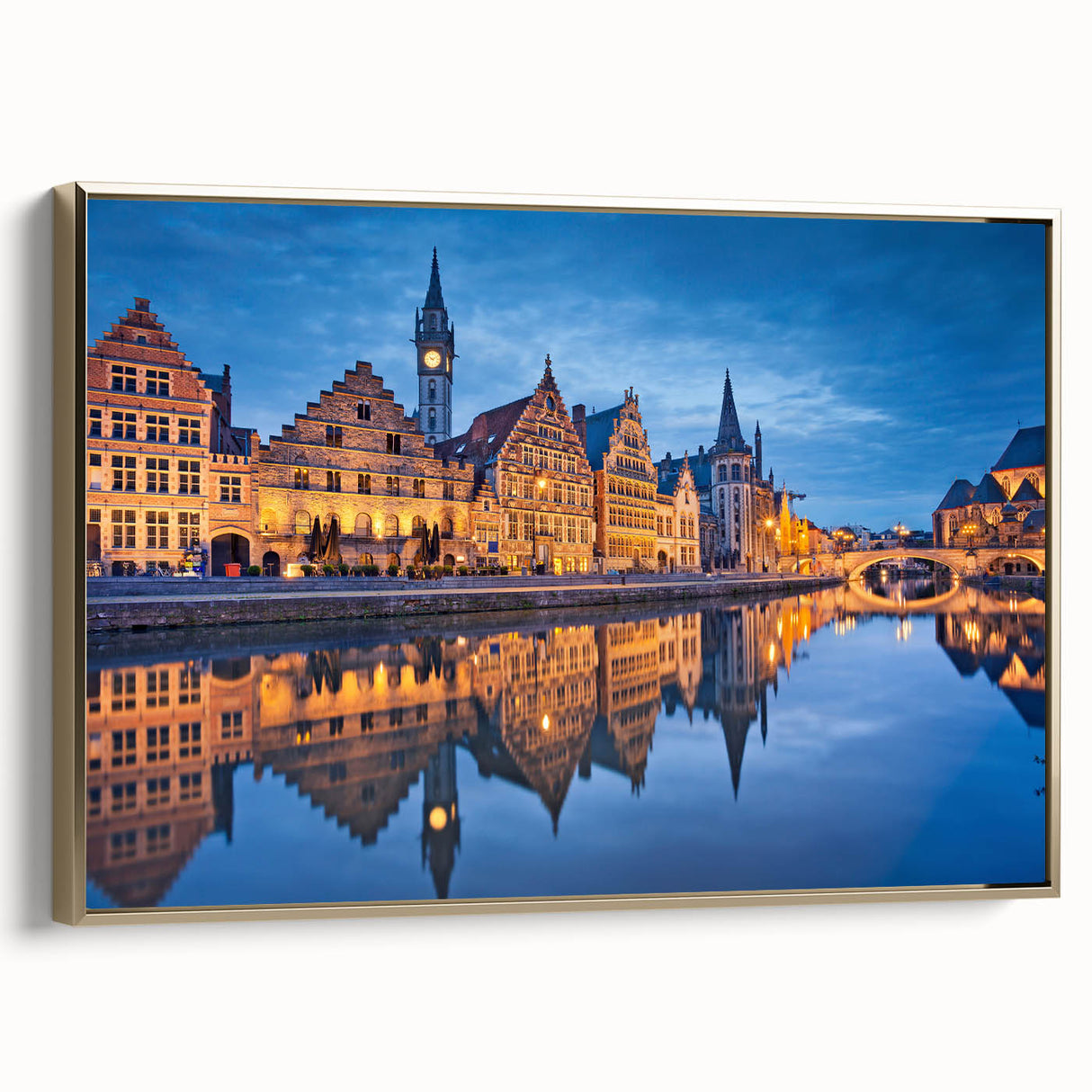 Framed canvas featuring a vintage-style landscape painting of a European scene, with muted earth tones.