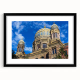 Abstract art print of Berlin scenery in vibrant colors on a large, textured canvas, framed in black.