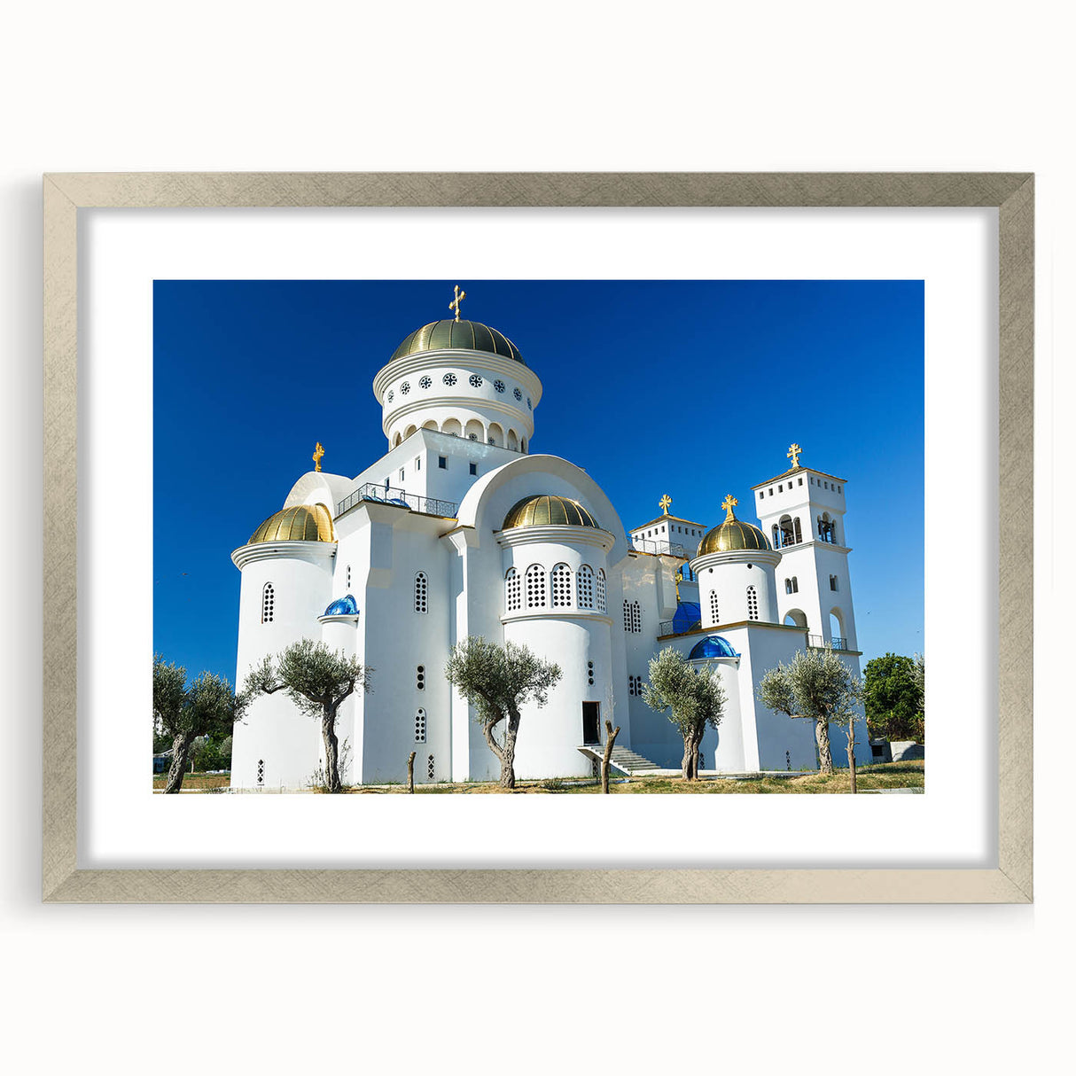 Extra large abstract art print depicting a textured European scenery in muted earth tones, framed in silver.