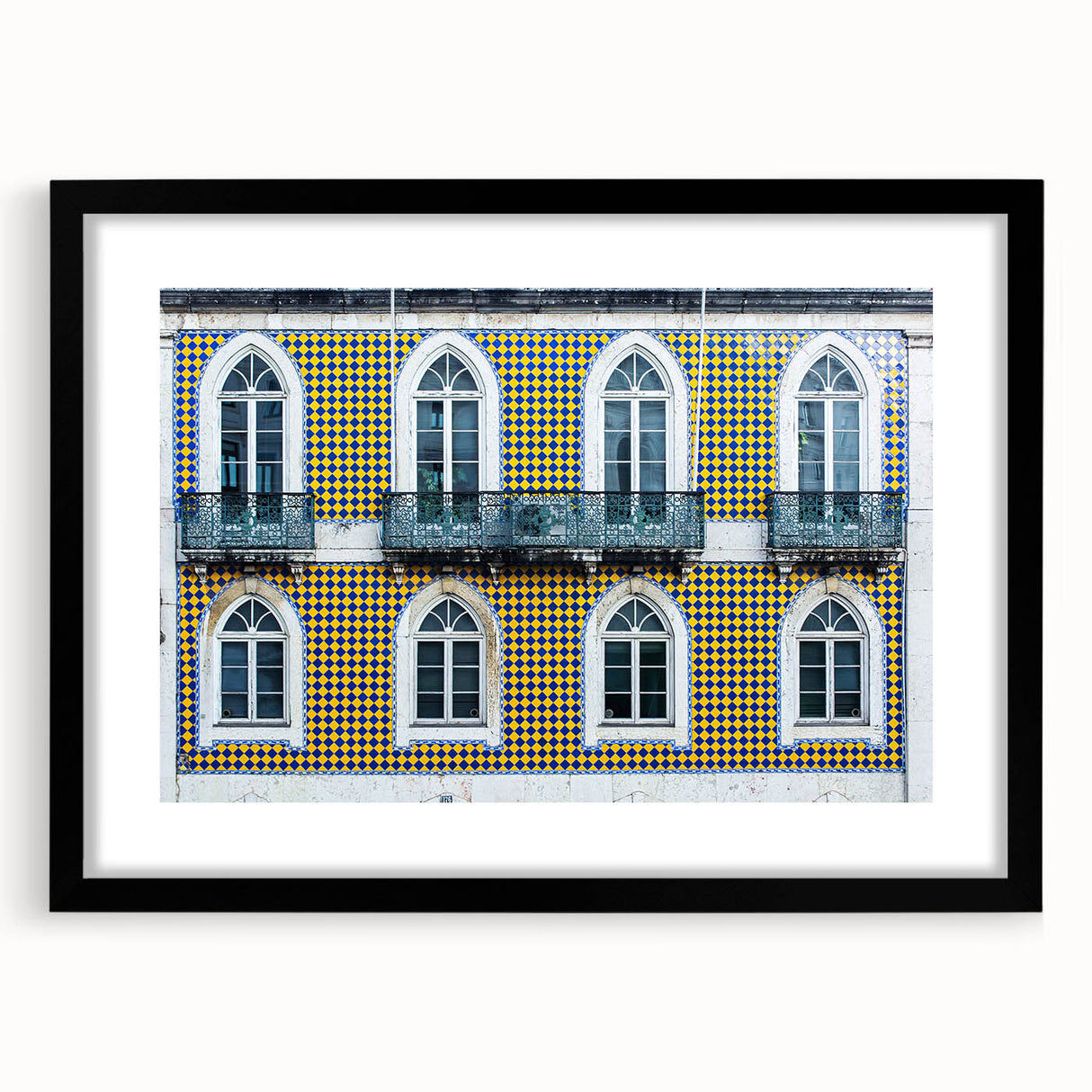 Extra large abstract art print of a colorful, textured Lisbon scenery on a framed black mat, ideal for living room decor.