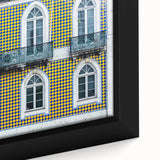 Extra large framed canvas of Lisbon scenery in black with colorful, textured accents, ideal for living room decor.