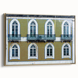 Framed canvas of a vintage Lisbon landscape in muted gold and black tones, ideal for bedroom wall art.