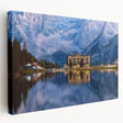 Large art depicting a serene Slovenian landscape on stretched canvas, with muted green and blue tones.