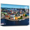 Large abstract wall art of a European scenery in muted blue and green tones on acrylic glass.
