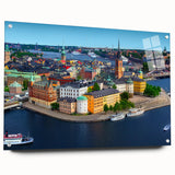 Large abstract wall art of a European scenery in muted blue and green tones on acrylic glass.