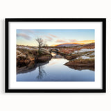 Abstract art print of a vibrant European landscape in a black frame, ideal for living room decor.