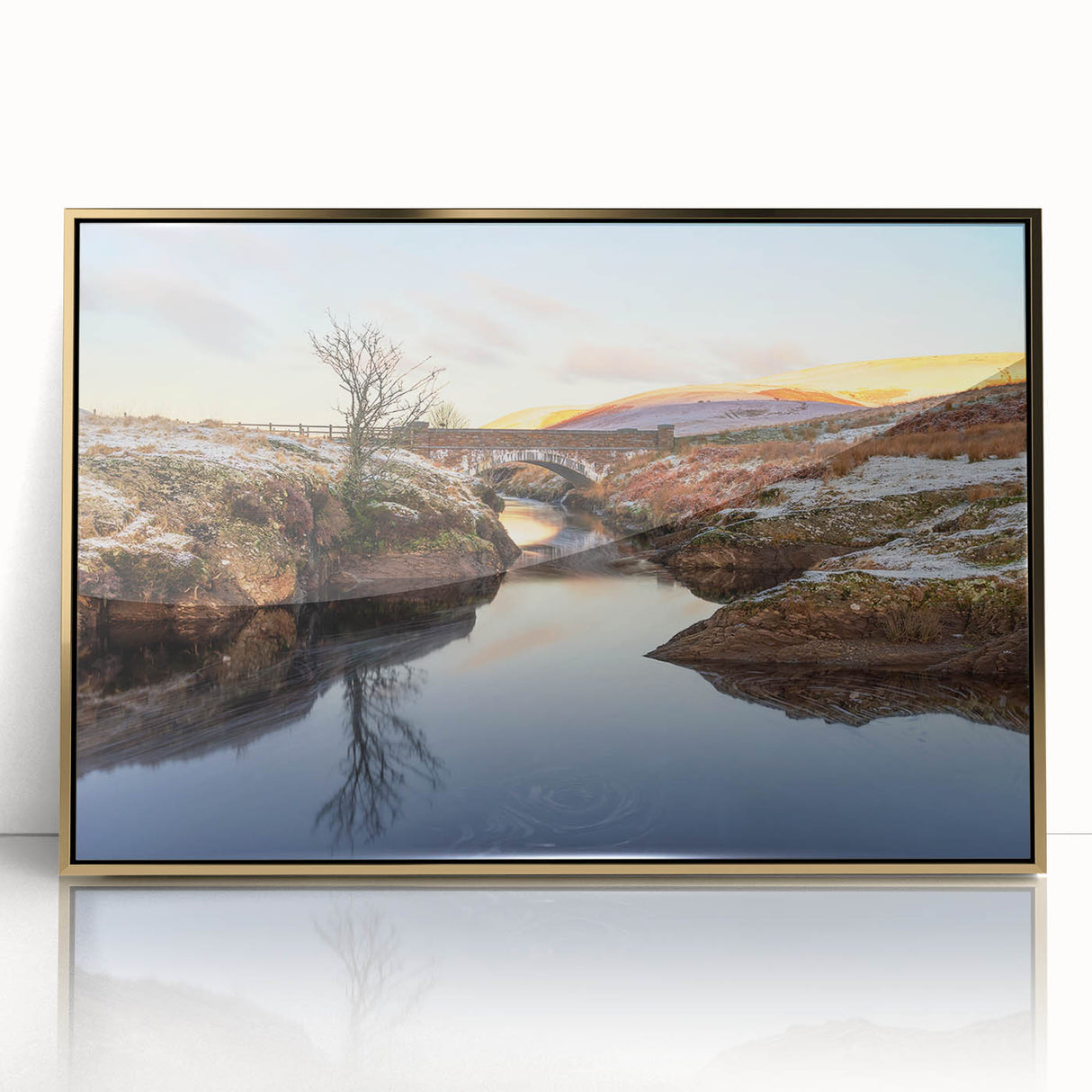 Large art print of a serene Welsh landscape in muted green and blue tones, framed in gold acrylic.