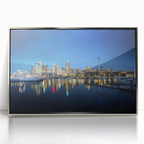 Mid-century modernist art depicting the Auckland skyline in muted blue and silver tones on a framed acrylic print.