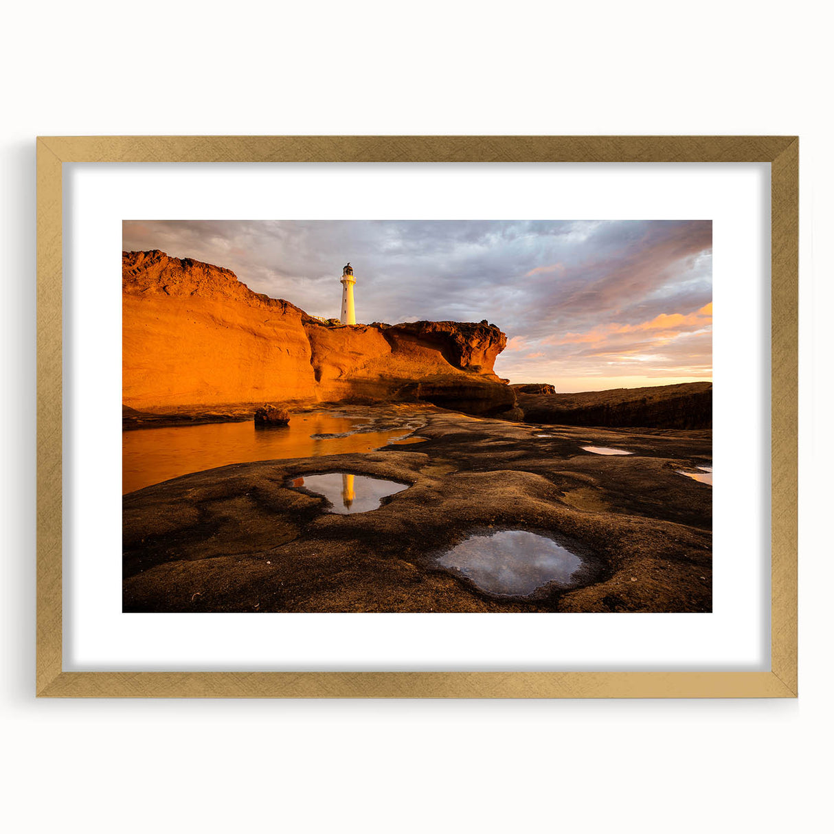 Extra large abstract art print of Wellington skyline in textured gold frame, with muted earth tones.