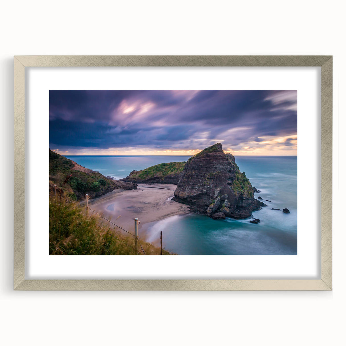 Textured abstract art print of New Zealand's West Coast in muted blue and gray tones, framed in silver.