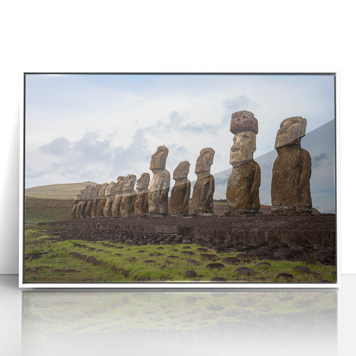 Modern art wall decor featuring Easter Island statues on a framed acrylic, with muted earth tones.