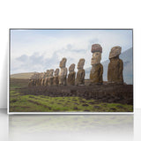 Modern art wall decor featuring Easter Island statues on a framed acrylic, with muted earth tones.