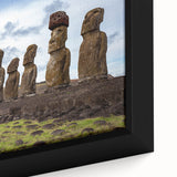 Close-up of a black framed canvas featuring a textured depiction of Easter Island statues in vibrant, colorful art.
