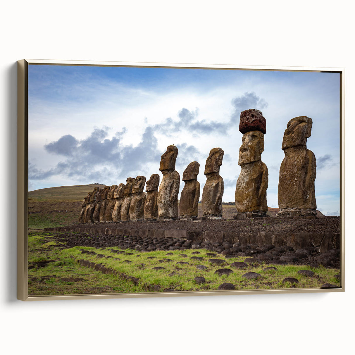 Framed canvas wall art depicting Easter Island statues in a vintage poster style with muted earth tones.