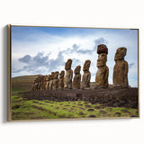 Framed canvas wall art depicting Easter Island statues in a vintage poster style with muted earth tones.