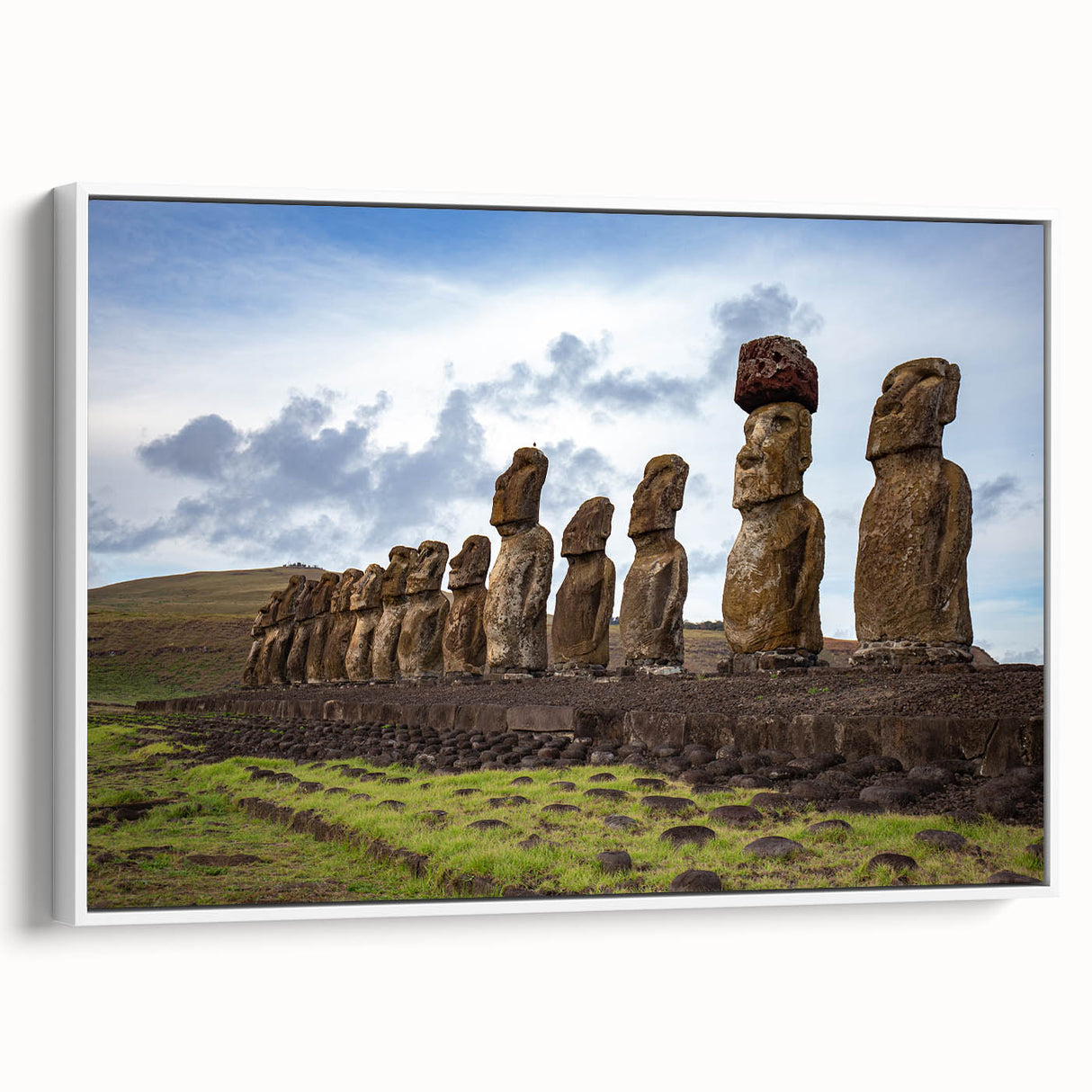 Vintage poster art of Easter Island statues on a framed canvas, featuring muted earth tones, ideal for living room decor.