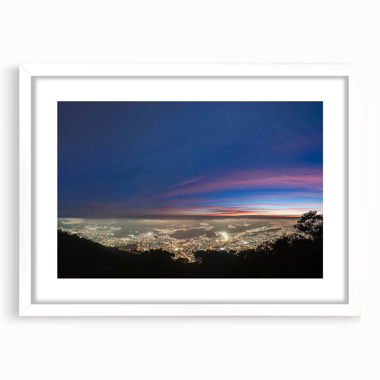 Abstract art print of a Venezuelan landscape in muted earth tones on a framed white mat, suitable for dining room decor.