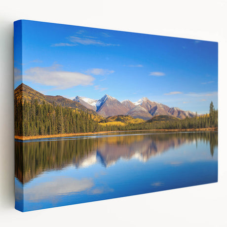 Alaskan landscape on large stretched canvas showing snowy mountains and forest in muted earth tones.