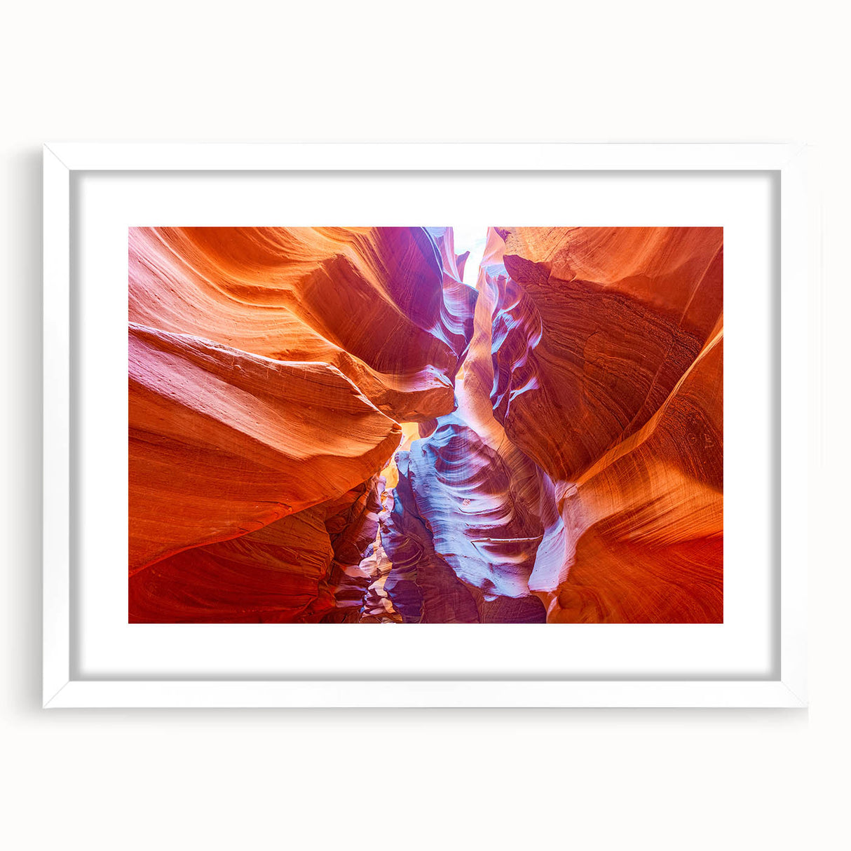 Abstract art print of the Grand Canyon in earth tones on a white-matted frame, suitable for dining room decor.