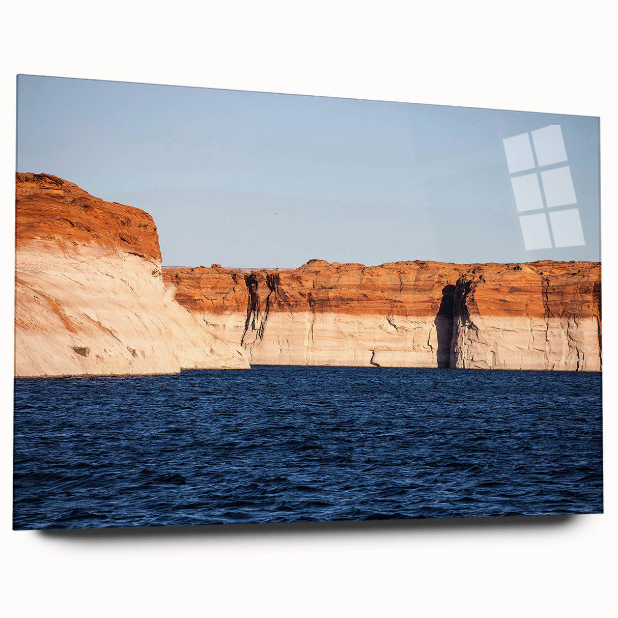 Large abstract wall art of Lake Powell in muted blue and orange tones on acrylic glass.