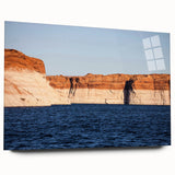 Large abstract wall art of Lake Powell in muted blue and orange tones on acrylic glass.