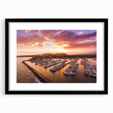 Colorful abstract art print of Santa Barbara scenery in a black frame, ideal for living room decor.