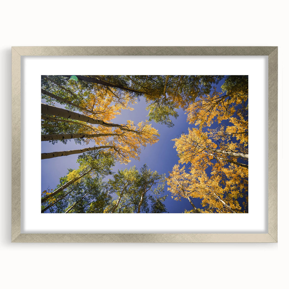 Textured abstract art print of a Colorado landscape in muted earth tones, framed in silver, ideal for bedroom decor.
