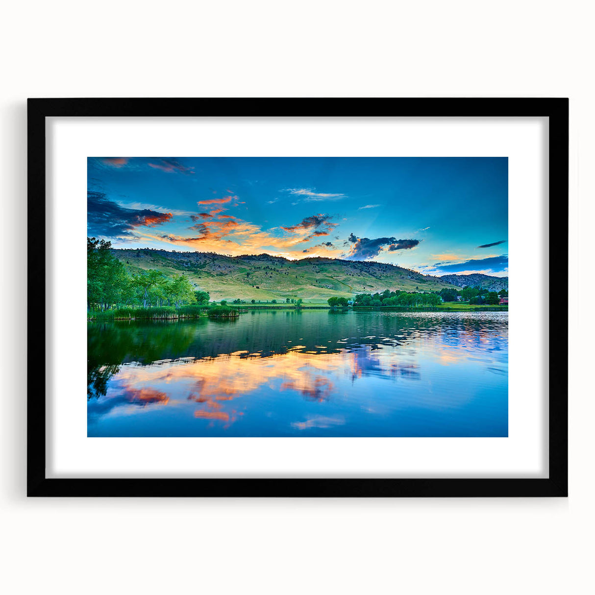Abstract art print of Boulder, Colorado, in vibrant colors on a large textured canvas, framed in black.