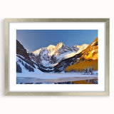 Textured art print of Maroon Bells, Colorado, in muted earth tones, framed in silver, ideal for bedroom decor.