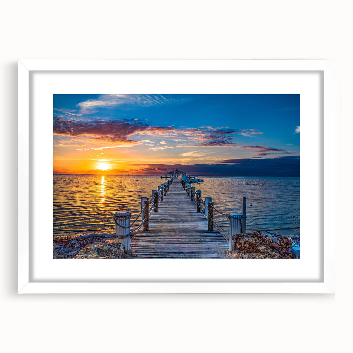 Abstract art print of Florida Keys scenery in muted blue and green tones on a white framed mat, ideal for dining room decor.