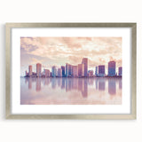 Textured abstract art print of Miami scenery in muted blue and gray, framed in silver, ideal for bedroom art.