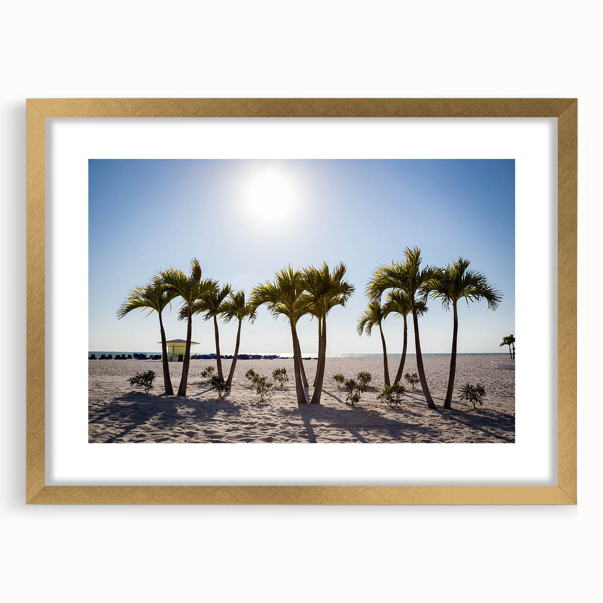 Extra large abstract art print featuring textured palm trees in muted green and beige, framed in gold.