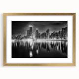 Extra large abstract art print of Chicago skyline in muted gray and gold hues on a framed canvas.