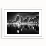 Abstract art print of Chicago skyline in muted blue and gray tones on a framed white canvas, ideal for dining room decor.