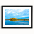 Abstract art print featuring vibrant, colorful swirls on a textured canvas, framed in black, ideal for living room decor.