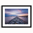 Colorful abstract art print of Annapolis scenery in vibrant hues on a large framed canvas, ideal for living room decor.