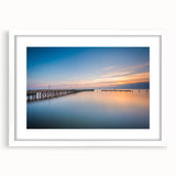 Abstract art print of Chesapeake Bay in muted blue and gray tones on a white framed mat, suitable for dining room decor.