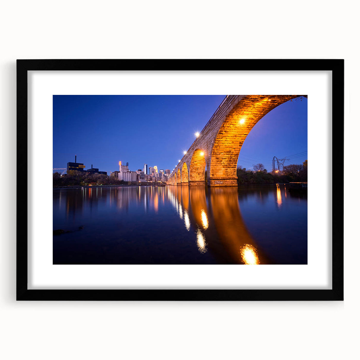 Extra large abstract art print of Minneapolis skyline in vibrant, colorful textures on a black framed canvas.