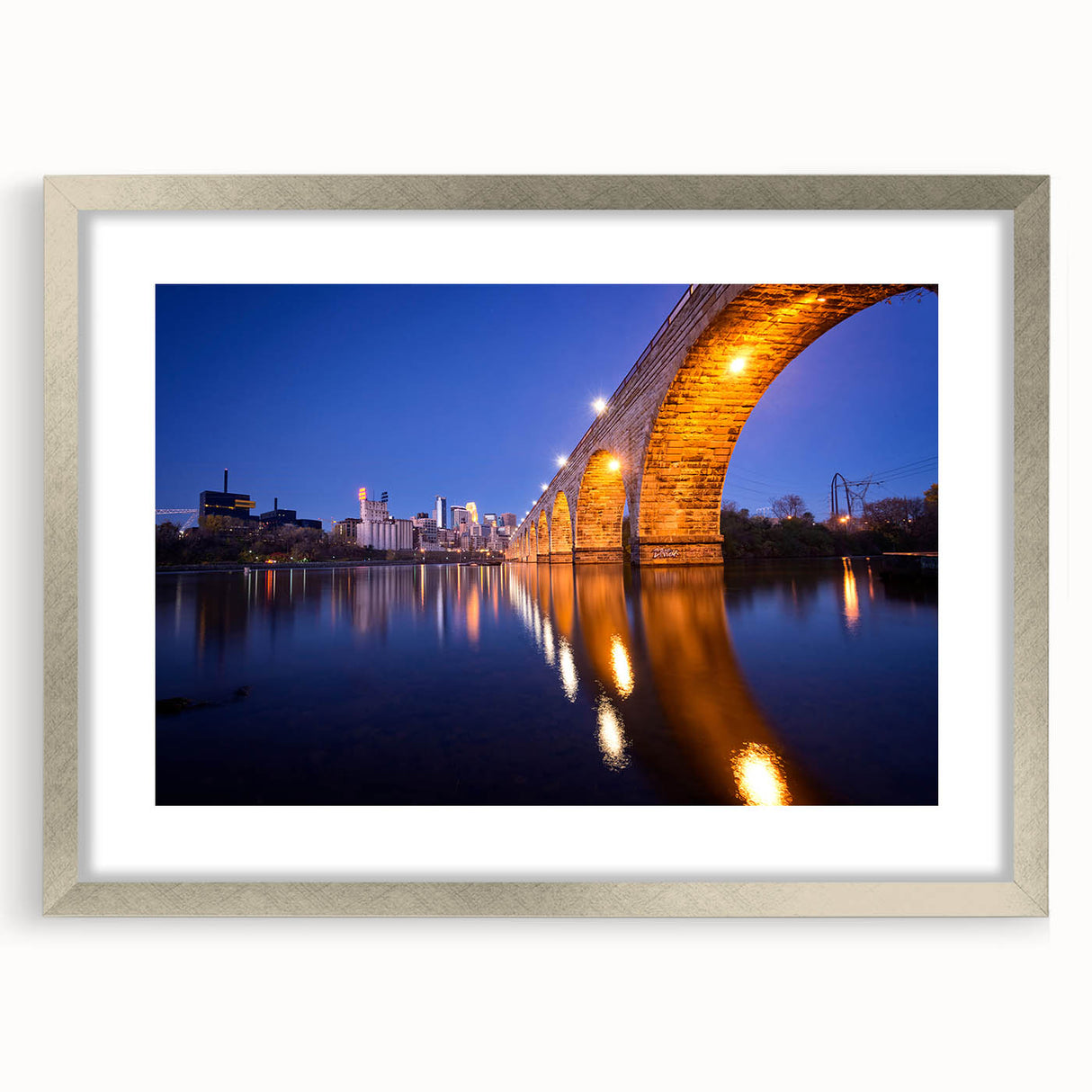 Abstract art print of Minneapolis skyline in muted blue and silver tones on framed canvas, suitable for dining room decor.