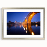 Abstract art print of Minneapolis skyline in muted blue and silver tones on framed canvas, suitable for dining room decor.