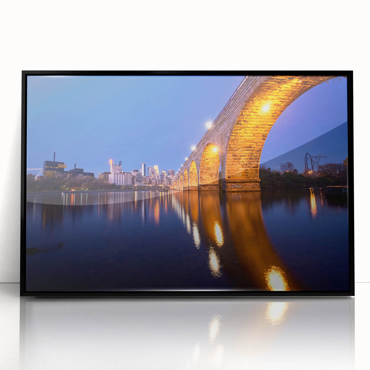 Large abstract wall art depicting the Minneapolis skyline in muted gray tones on a framed acrylic print.