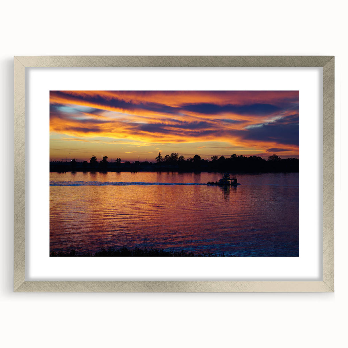 Textured art of abstract Mississippi scenery in muted earth tones on a framed silver mat, suitable for bedroom decor.